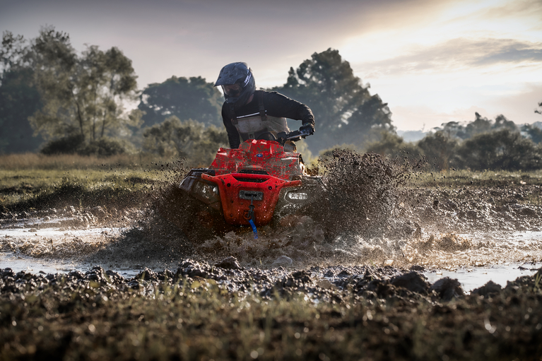 Polaris Sportsman XP 1000 Mud Edition riding through mud near Baton Rouge